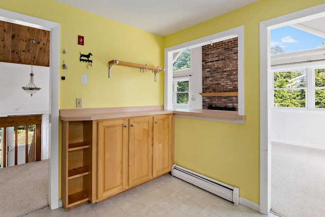 3 Waterside Dr, North Falmouth, MA 02556 - kitchen with a baseboard heating unit, plenty of natural light, and open shelves