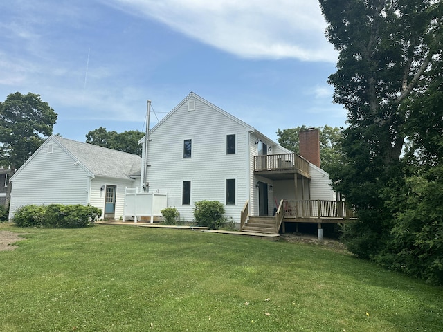 15 Beach St, East Falmouth, MA 02536 - rear view of property with a lawn, a deck, and a chimney