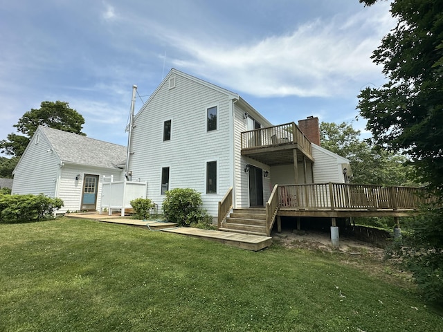 15 Beach St, East Falmouth, MA 02536 - back of property with a deck, a balcony, and a yard