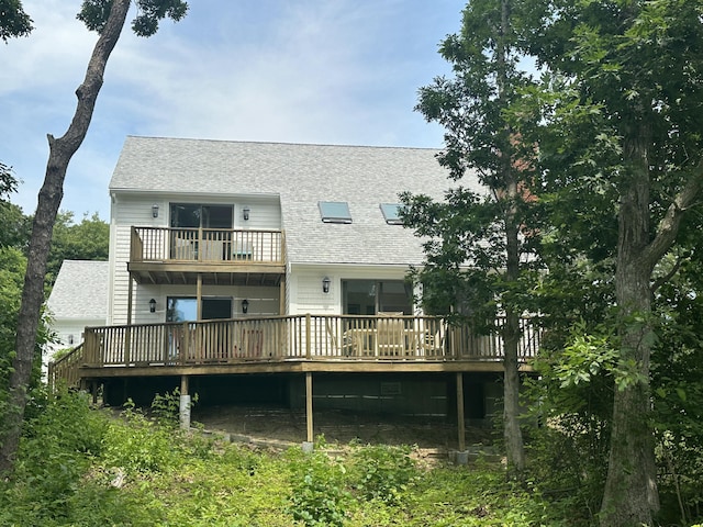 15 Beach St, East Falmouth, MA 02536 - back of property featuring roof with shingles, a deck, and a balcony