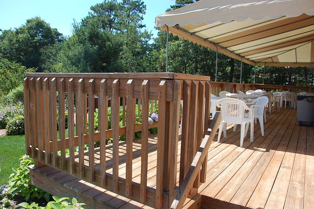 wooden deck with outdoor dining space