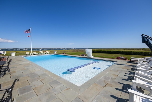 view of swimming pool featuring a patio