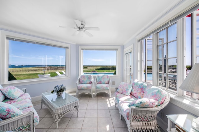 sunroom / solarium featuring ceiling fan and a wealth of natural light