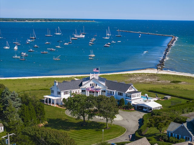 bird's eye view with a water view and a beach view