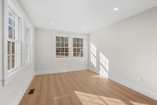 empty room with light wood-type flooring