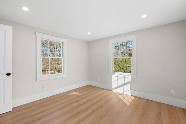 unfurnished room featuring light wood-type flooring