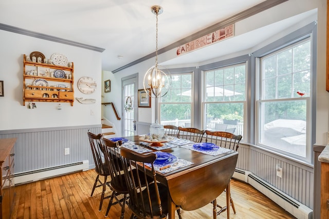 43 Owl Pond Rd, Brewster, MA 02631 - dining room featuring baseboard heating, ornamental molding, stairway, light wood-style floors, and a chandelier