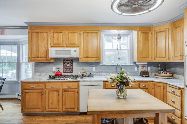 43 Owl Pond Rd, Brewster, MA 02631 - kitchen featuring white appliances, decorative backsplash, ornamental molding, light wood finished floors, and baseboard heating