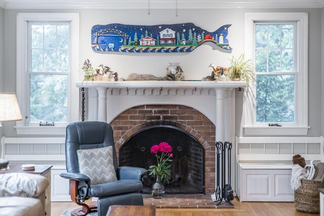 43 Owl Pond Rd, Brewster, MA 02631 - living room with plenty of natural light, crown molding, ceiling fan, light wood-style floors, and a baseboard heating unit