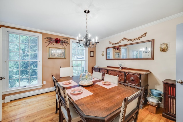 43 Owl Pond Rd, Brewster, MA 02631 - dining room with a chandelier, baseboard heating, light wood-style flooring, and crown molding