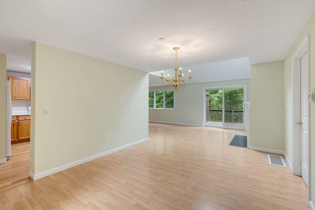 15 Pebble Beach Ave, Mashpee, MA 02649 - unfurnished room featuring light wood finished floors and a chandelier