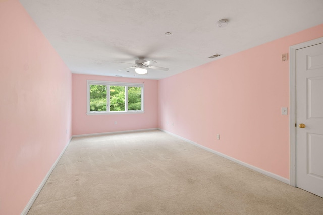 15 Pebble Beach Ave, Mashpee, MA 02649 - empty room featuring ceiling fan, light carpet, and a smoke detector