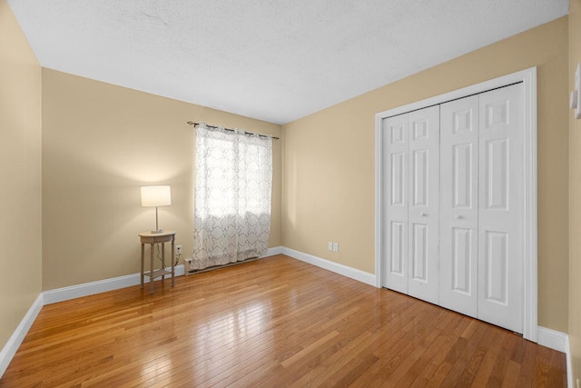 800 Bearses Way Unit 1Wd, Hyannis, MA 02601 - unfurnished bedroom with hardwood / wood-style flooring and a closet