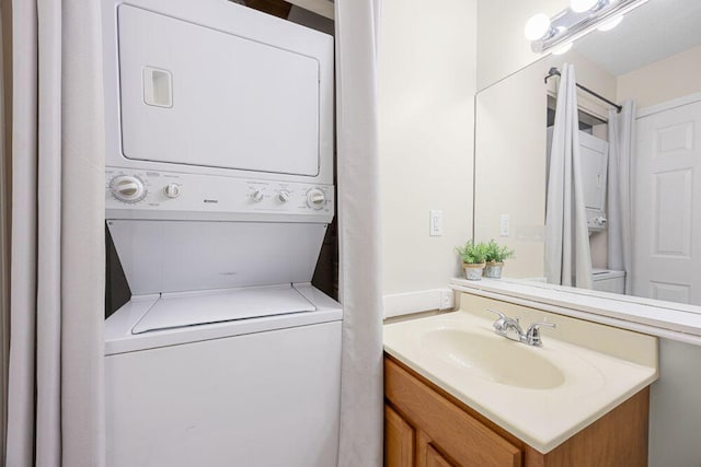 800 Bearses Way Unit 1Wd, Hyannis, MA 02601 - laundry room featuring stacked washer / drying machine