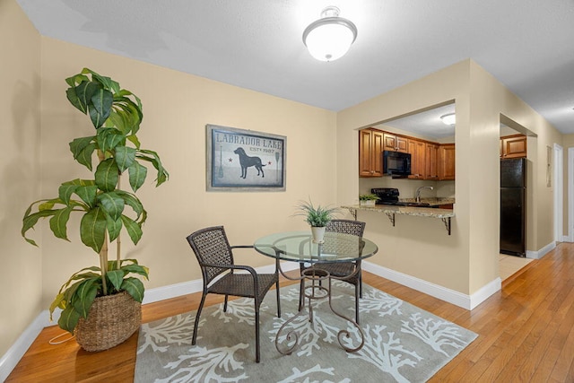 800 Bearses Way Unit 1Wd, Hyannis, MA 02601 - dining space with light wood finished floors and baseboards