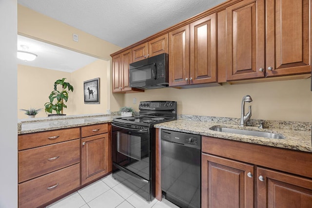 800 Bearses Way Unit 1Wd, Hyannis, MA 02601 - kitchen featuring black appliances, brown cabinets, light tile patterned floors, and light stone countertops