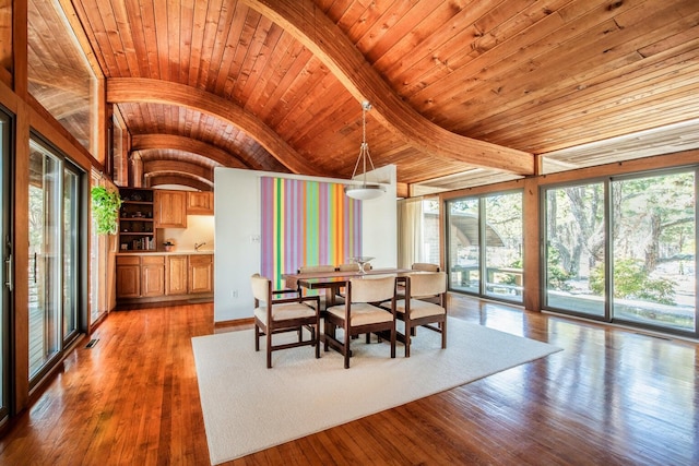 unfurnished dining area with hardwood / wood-style flooring, lofted ceiling, and wood ceiling