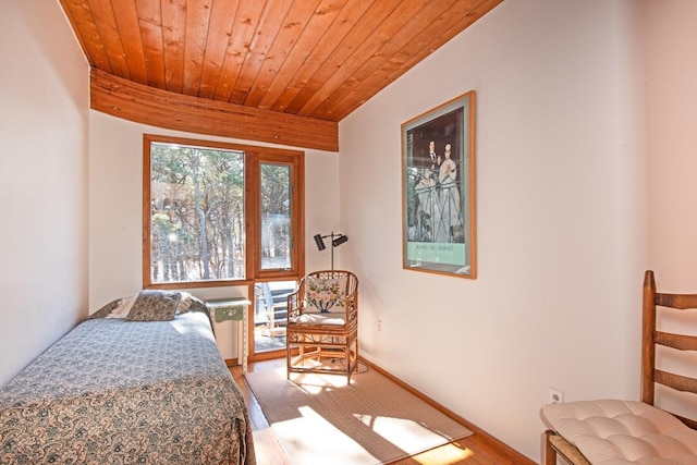 bedroom with hardwood / wood-style floors and wooden ceiling