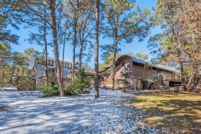 rear view of property with a wooden deck