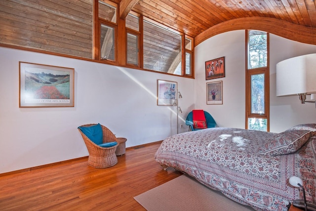 bedroom featuring wood-type flooring and vaulted ceiling