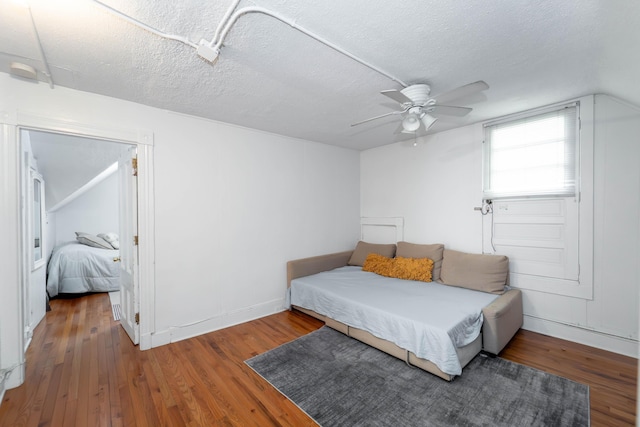 352 Bishop St, Framingham, MA 01702 - bedroom featuring wood finished floors, a textured ceiling, ceiling fan, and baseboards