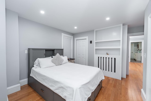 352 Bishop St, Framingham, MA 01702 - bedroom featuring radiator, light wood-type flooring, recessed lighting, baseboards, and a closet