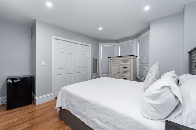 352 Bishop St, Framingham, MA 01702 - bedroom featuring light wood-style flooring, recessed lighting, a closet, baseboards, and fridge