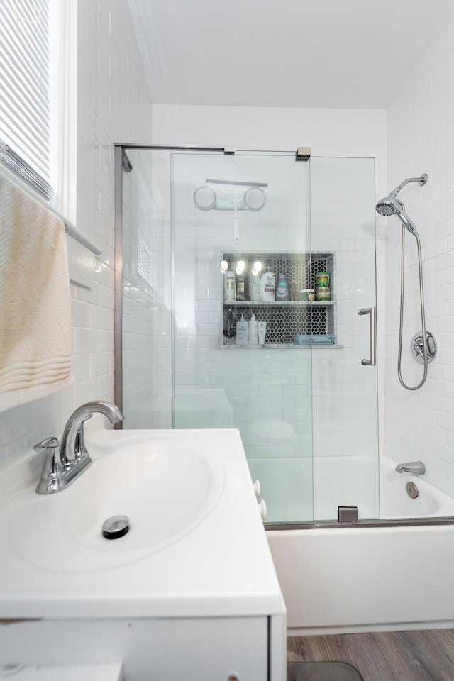 352 Bishop St, Framingham, MA 01702 - bathroom with bath / shower combo with glass door, wood finished floors, and vanity