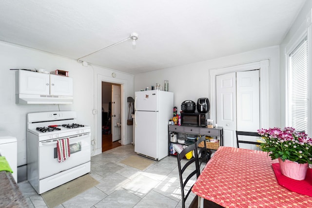 352 Bishop St, Framingham, MA 01702 - kitchen with white appliances, under cabinet range hood, and white cabinetry