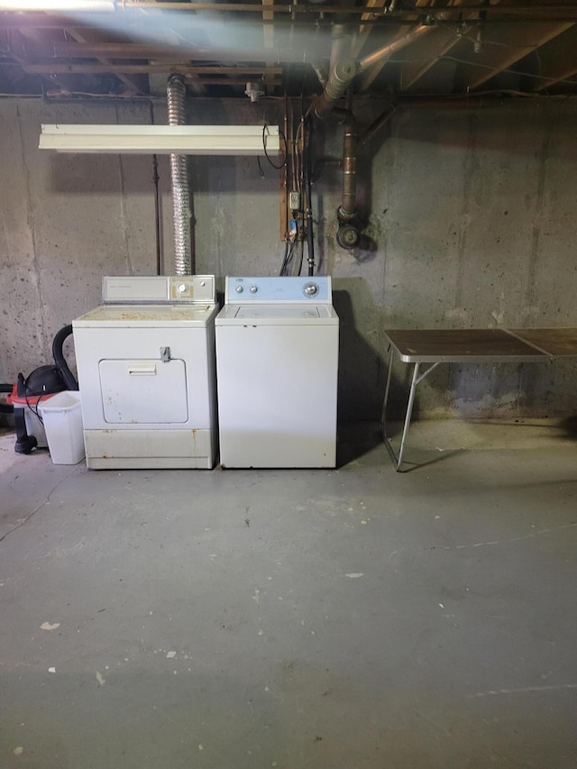 unfinished basement featuring washer and clothes dryer