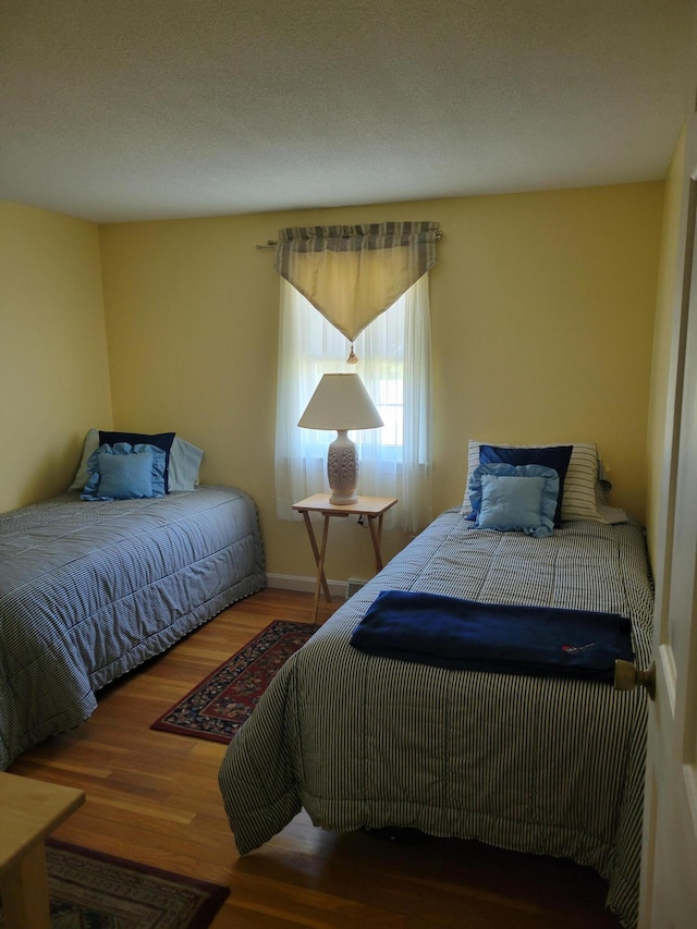 bedroom featuring wood finished floors