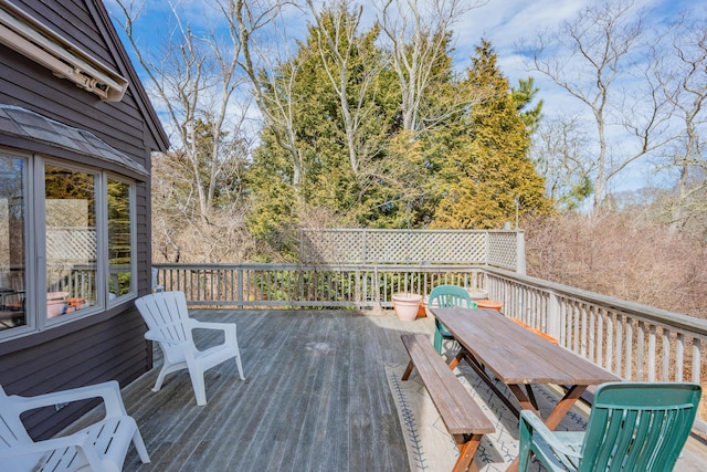 wooden deck with outdoor dining area