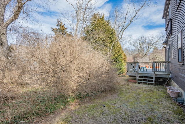 view of yard with a wooden deck