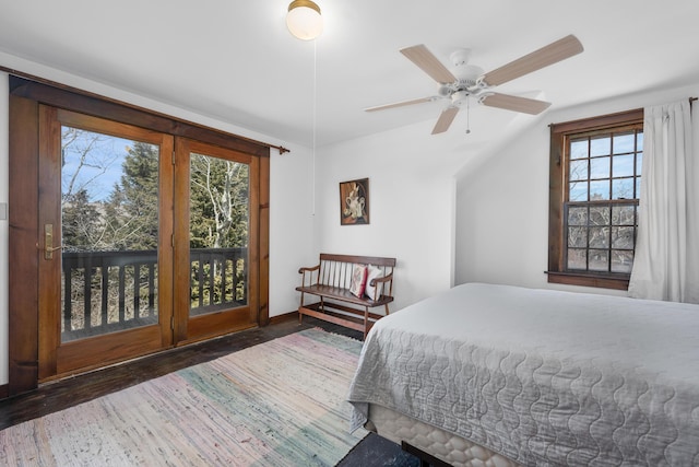 bedroom with wood finished floors and access to exterior