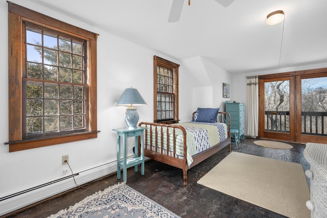 bedroom with access to outside, multiple windows, and wood finished floors