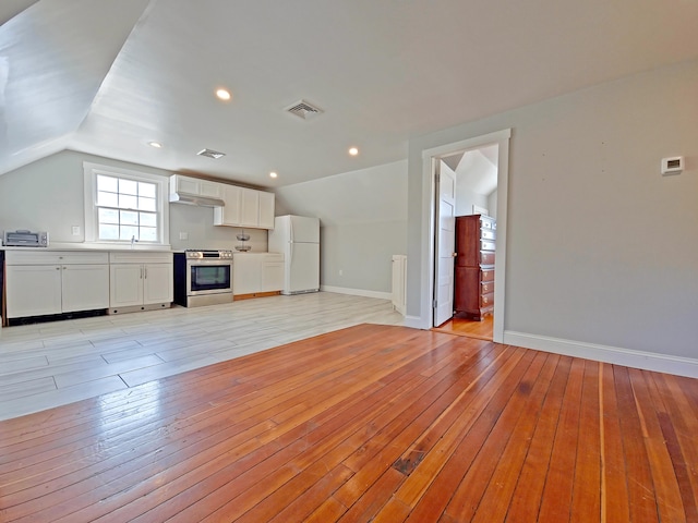23 Old Barnstable Rd, East Falmouth, MA 02536 - unfurnished living room featuring light wood-type flooring, a sink, baseboards, and vaulted ceiling