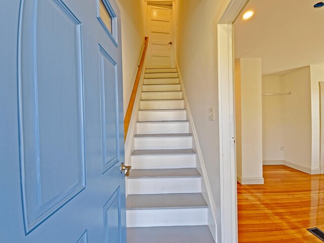 23 Old Barnstable Rd, East Falmouth, MA 02536 - stairway with baseboards, wood finished floors, and visible vents