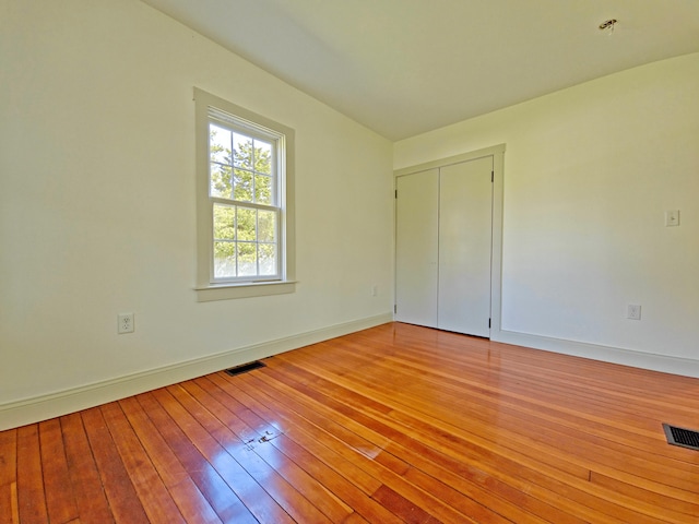 23 Old Barnstable Rd, East Falmouth, MA 02536 - unfurnished room with visible vents, light wood-style flooring, and baseboards