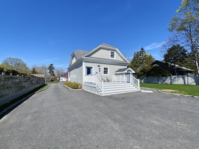 23 Old Barnstable Rd, East Falmouth, MA 02536 - view of front of property with fence and a deck