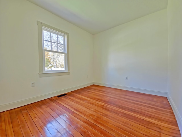 23 Old Barnstable Rd, East Falmouth, MA 02536 - empty room with baseboards, hardwood / wood-style flooring, and visible vents
