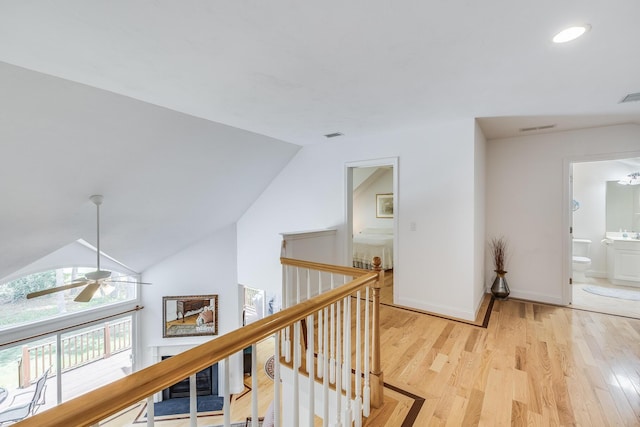 13 Laurel Hill Ct, Bourne, MA 02532 - hallway with light wood finished floors, vaulted ceiling, baseboards, an upstairs landing, and recessed lighting