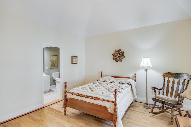 13 Laurel Hill Ct, Bourne, MA 02532 - bedroom with wood finished floors, baseboards, ensuite bathroom, and high vaulted ceiling