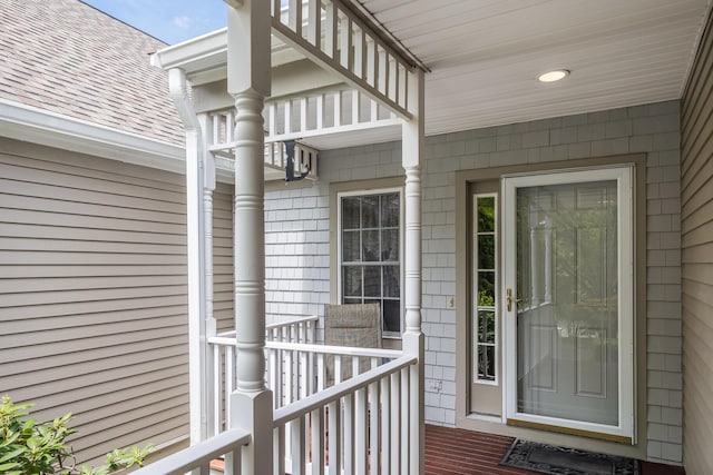 13 Laurel Hill Ct, Bourne, MA 02532 - property entrance featuring covered porch and a shingled roof