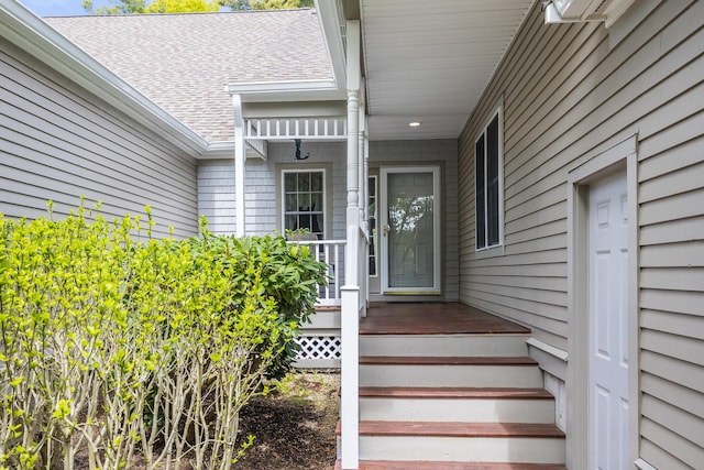 13 Laurel Hill Ct, Bourne, MA 02532 - doorway to property with a shingled roof and covered porch