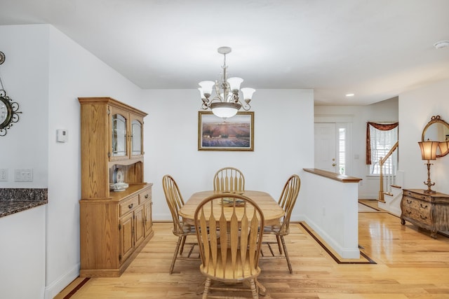 13 Laurel Hill Ct, Bourne, MA 02532 - dining space with light wood finished floors, a chandelier, stairway, baseboards, and recessed lighting