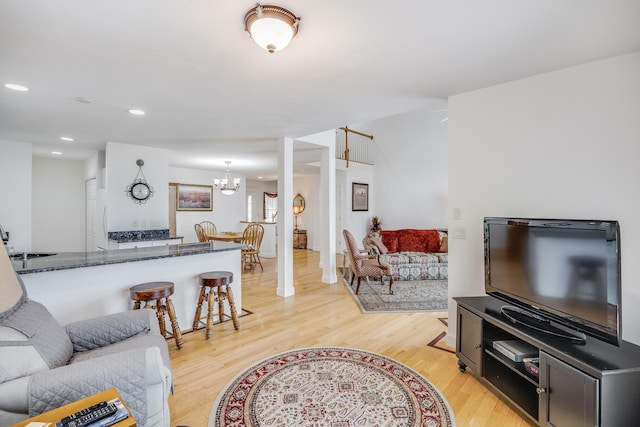 13 Laurel Hill Ct, Bourne, MA 02532 - living room featuring light wood-style flooring, a chandelier, and recessed lighting
