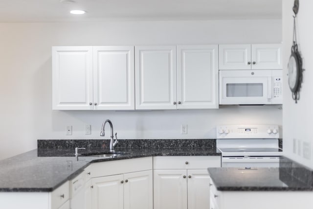 13 Laurel Hill Ct, Bourne, MA 02532 - kitchen with white appliances, a sink, and white cabinetry