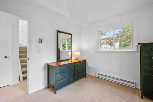 128 Whippoorwill Cir, Mashpee, MA 02649 - bedroom featuring baseboard heating, multiple windows, light carpet, and baseboards