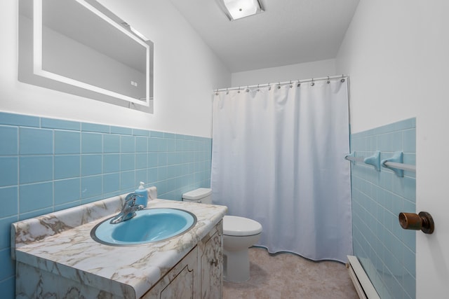 128 Whippoorwill Cir, Mashpee, MA 02649 - full bathroom featuring tile walls, toilet, vanity, a baseboard radiator, and curtained shower