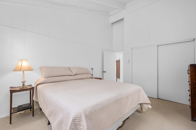 128 Whippoorwill Cir, Mashpee, MA 02649 - bedroom featuring light carpet, beamed ceiling, and a closet